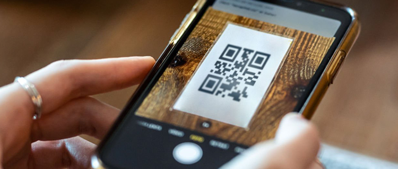 Scanning QR code indoors to access app game
