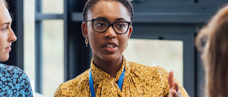 Person welcoming and informing visitors